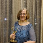 Alumni Katy Loebrich with her Emmy Award